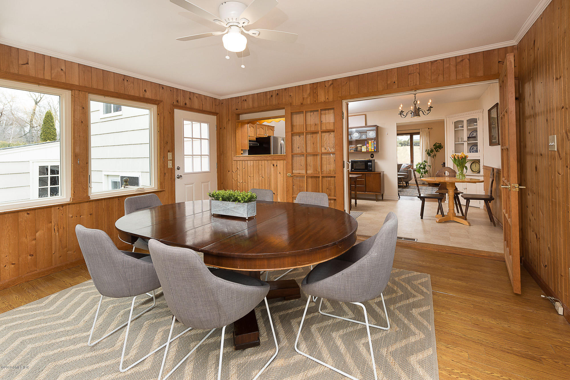 81 Mary Lane Riverside, CT 06878 - Photo 9 of 26 a dining room with furniture a chandelier and wooden floor