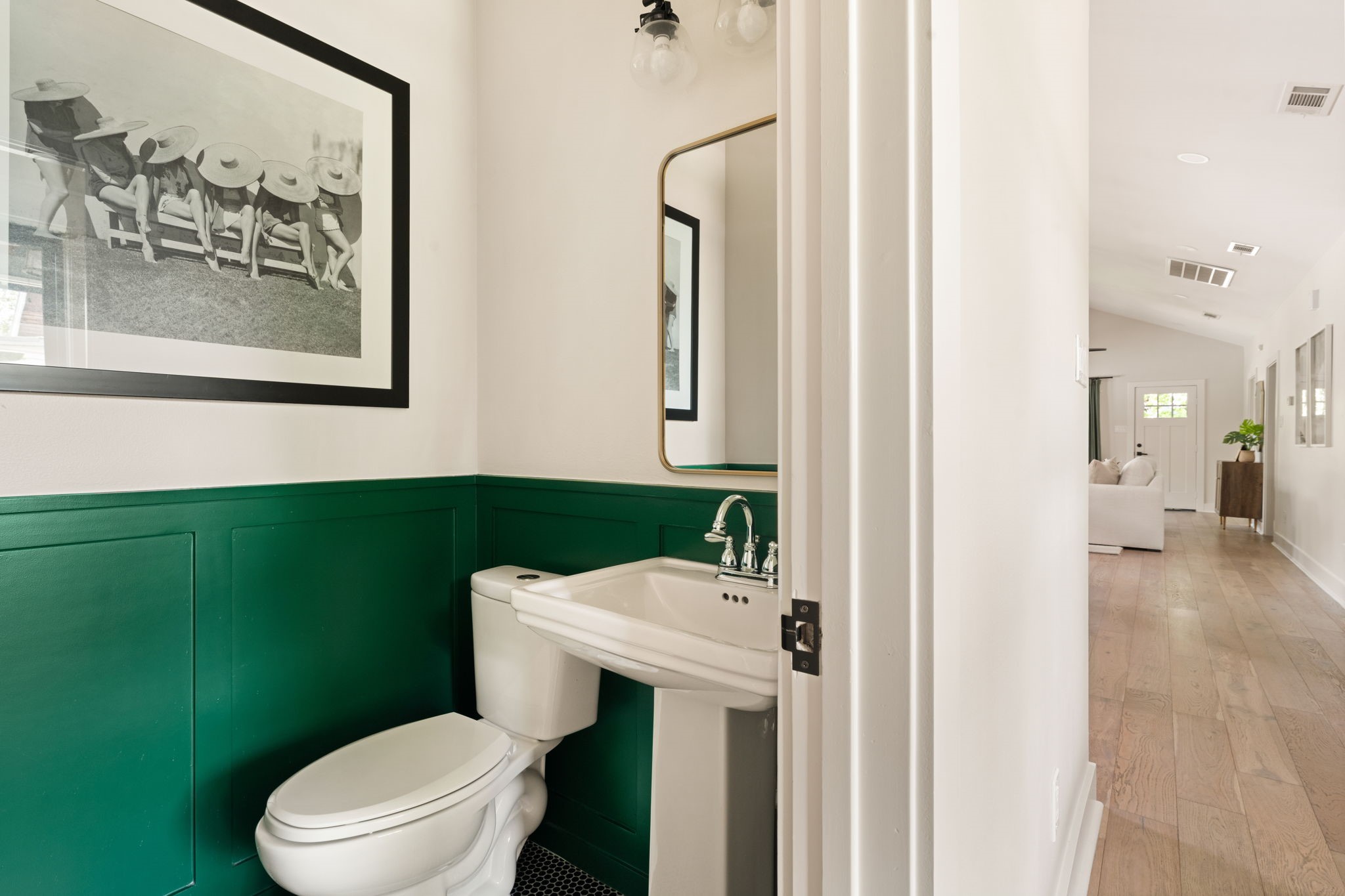 1022 Key Street Houston, TX 77009 - Photo 14 of 30 A powder room is conveniently located off the main living areas for guest use.