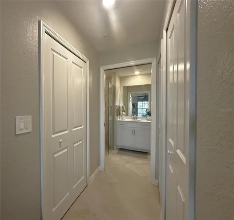 a bathroom with a shower sink and mirror