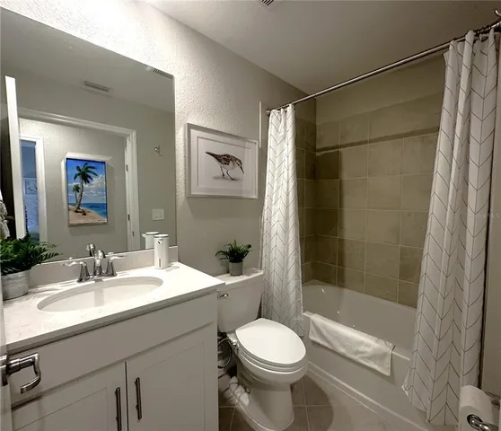 a living room with a couch and a flat screen tv