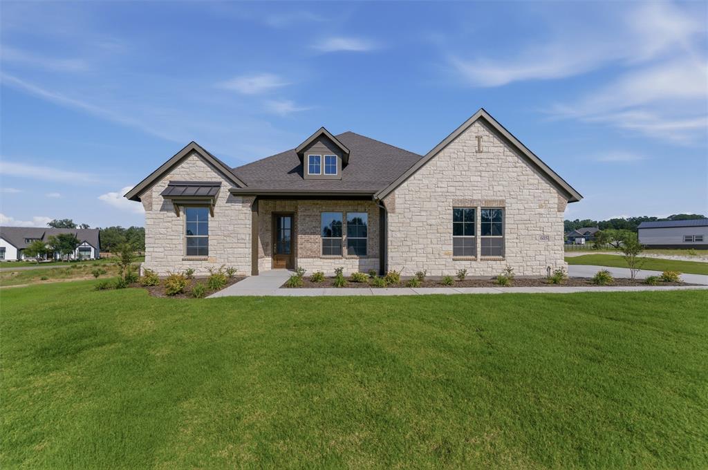 605 Tay Tay Way Springtown, TX 76082 - Photo 1 of 31 Stone facade residence with a prominent gabled roofline and dark shingle roofing