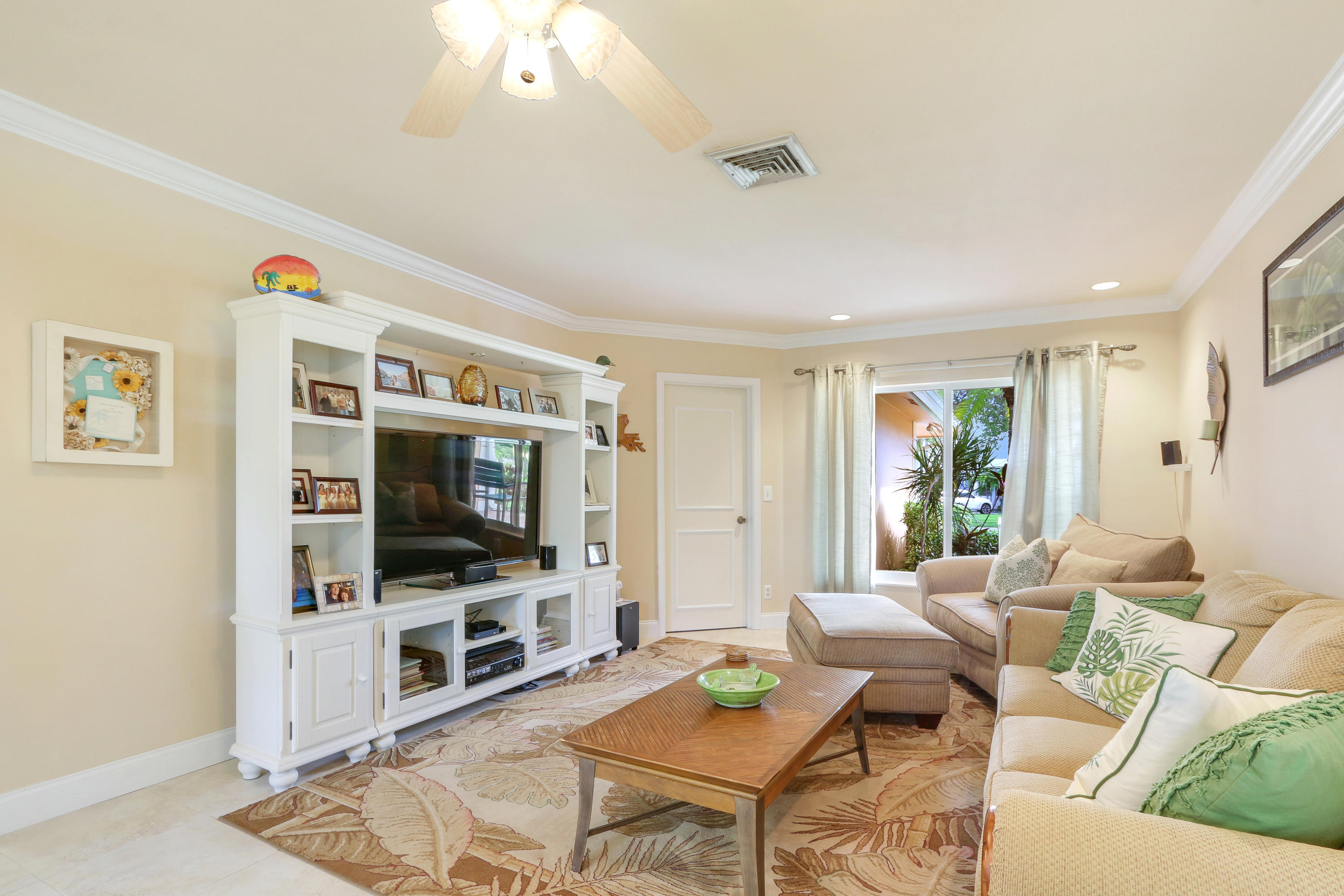 3533 Northeast 6th Drive Boca Raton, FL 33431 - Photo 13 of 23 a living room with furniture and a flat screen tv