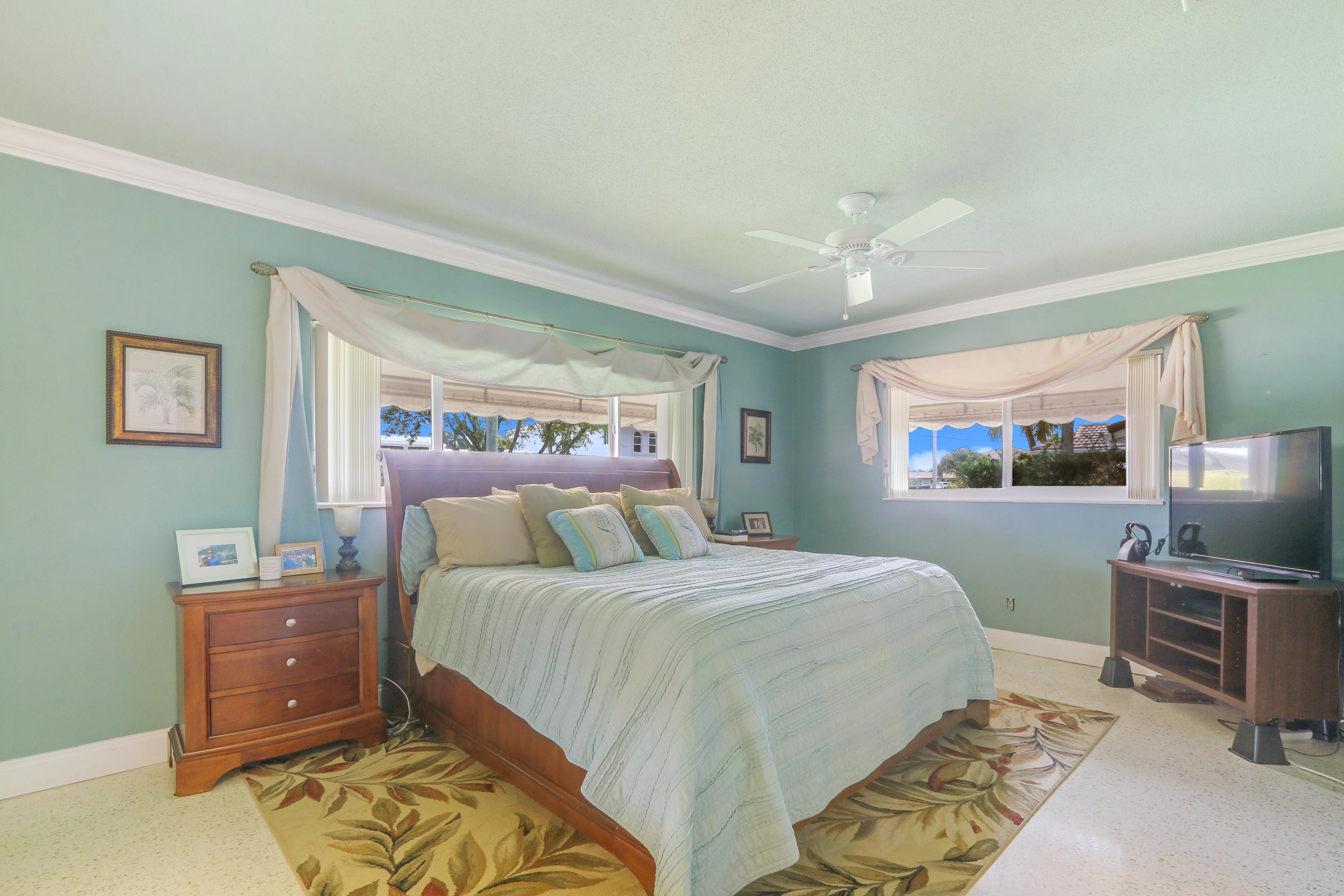 3533 Northeast 6th Drive Boca Raton, FL 33431 - Photo 14 of 23 a bedroom with a large bed and a window