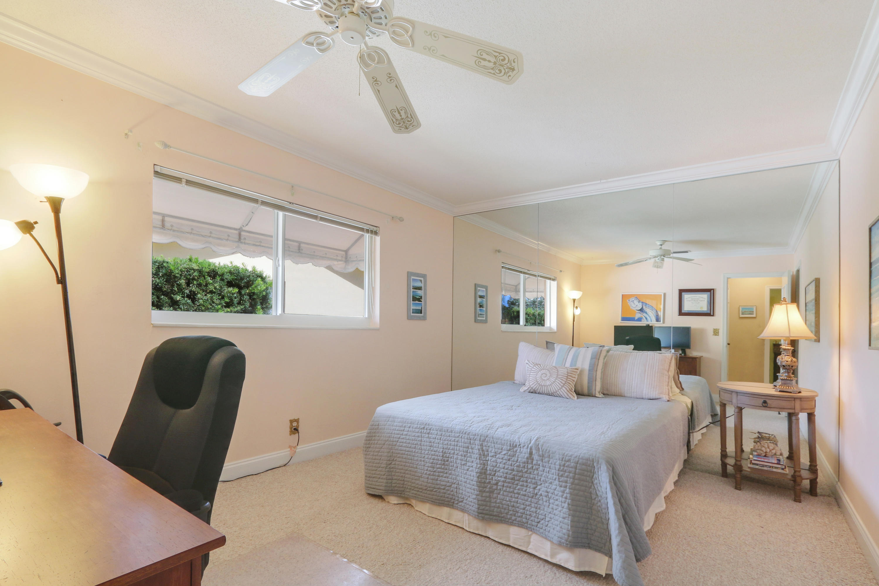 3533 Northeast 6th Drive Boca Raton, FL 33431 - Photo 17 of 23 a bedroom with a large bed and a window