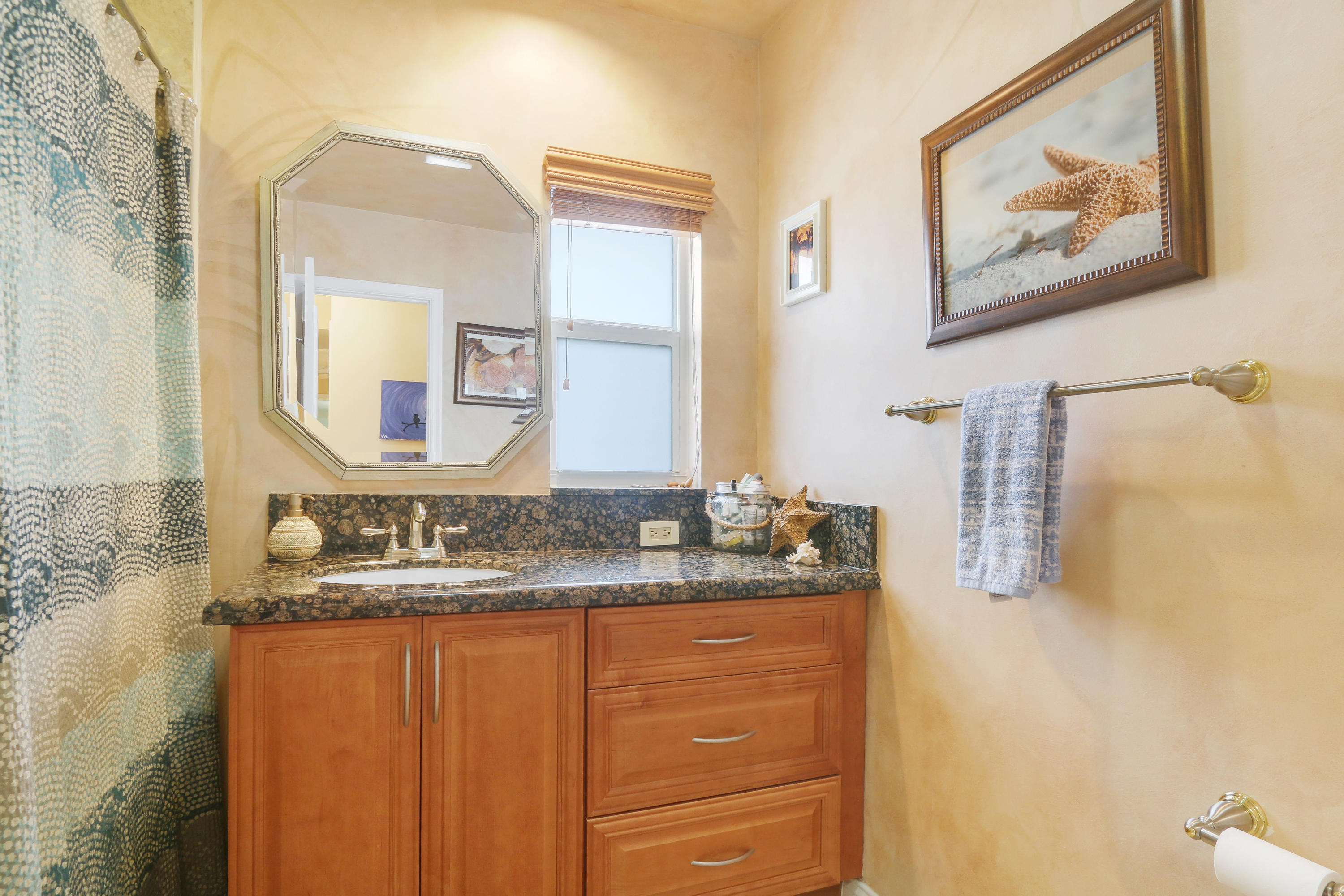 3533 Northeast 6th Drive Boca Raton, FL 33431 - Photo 18 of 23 a bathroom with a granite countertop double vanity sink and a mirror