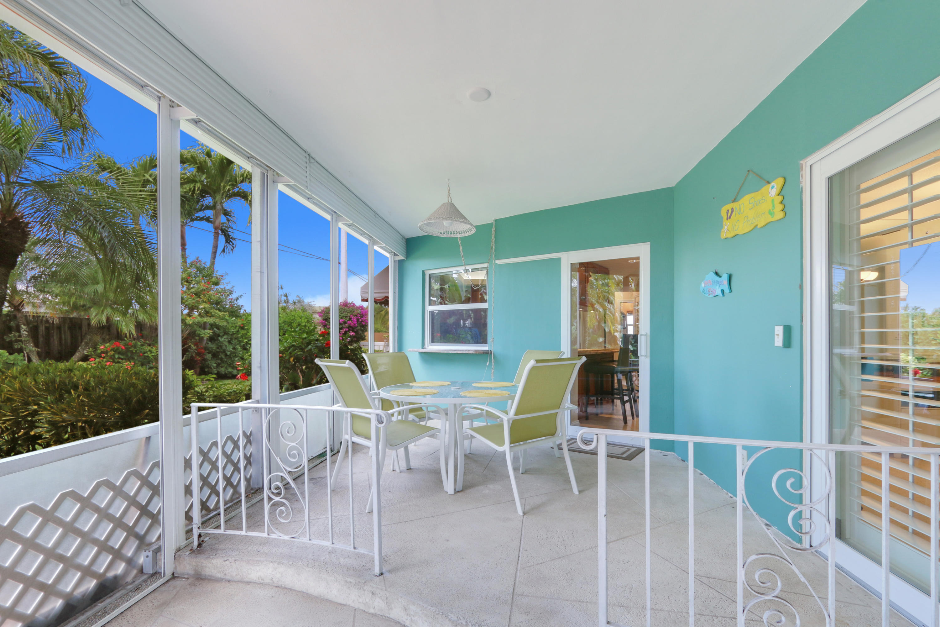 3533 Northeast 6th Drive Boca Raton, FL 33431 - Photo 20 of 23 a view of a patio with a table and chairs
