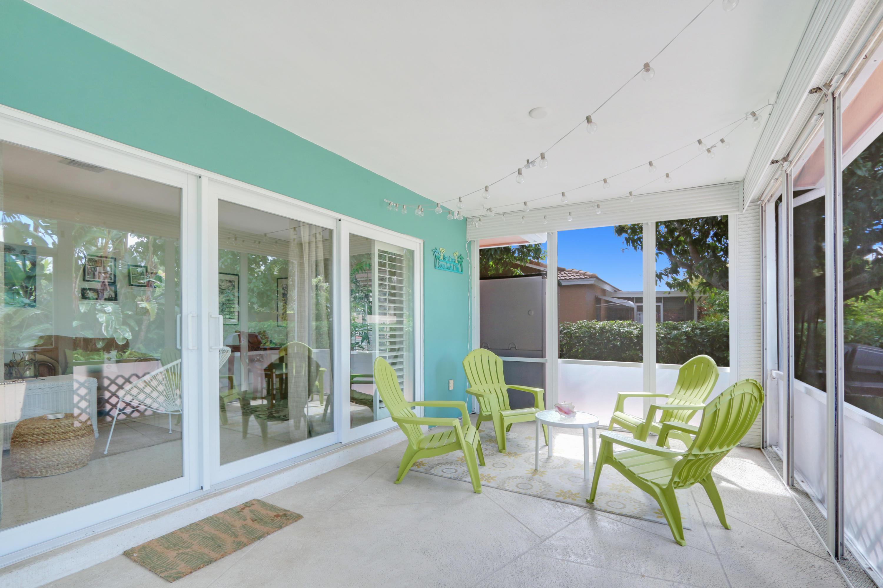 3533 Northeast 6th Drive Boca Raton, FL 33431 - Photo 21 of 23 a view of a patio with table and chairs and potted plants