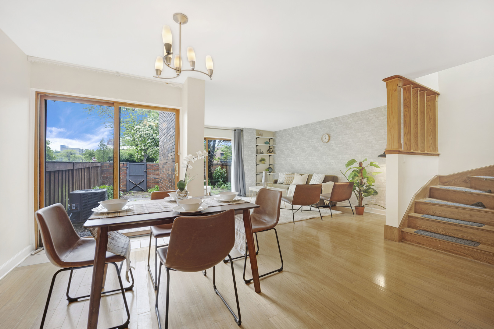 1252 West Westgate Terrace Chicago, IL 60607 - Photo 4 of 24 a dining room with furniture a chandelier and wooden floor
