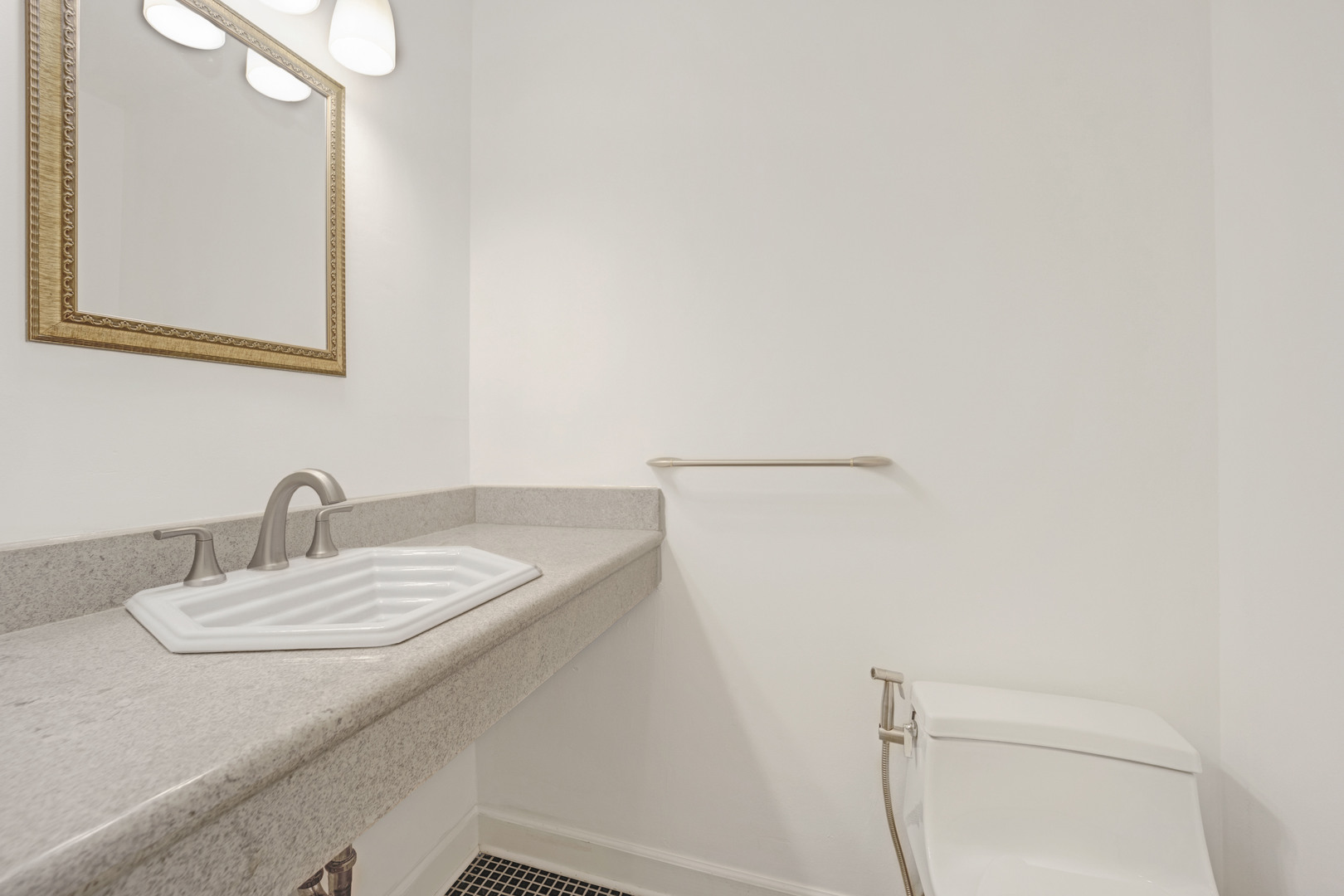 1252 West Westgate Terrace Chicago, IL 60607 - Photo 9 of 24 a bathroom with a sink and a mirror