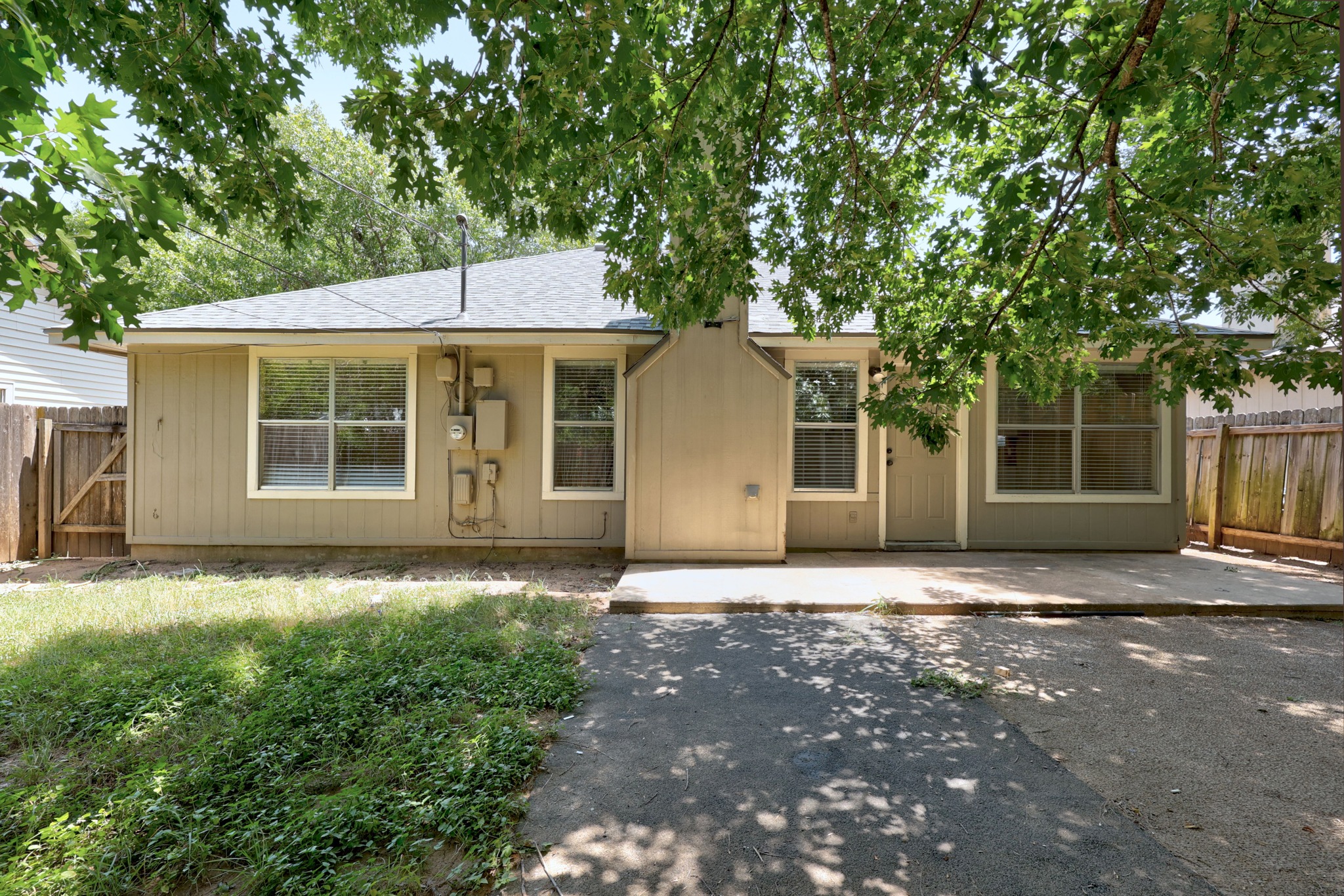 1806 Rusty Nail Loop Round Rock, TX 78681 - Photo 25 of 28 A modest home with a simple backyard, offering potential for outdoor enjoyment.