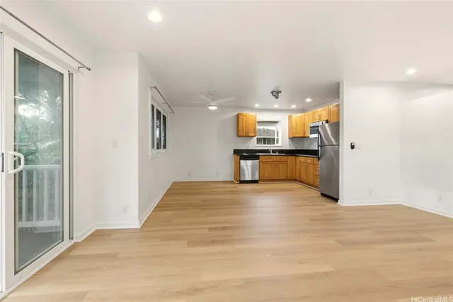 a view of a kitchen with a sink and a window
