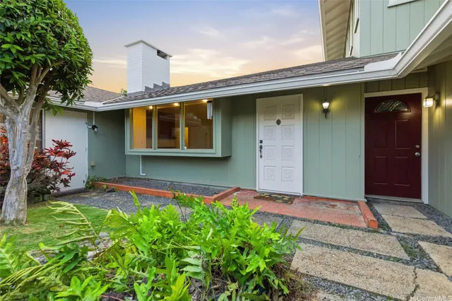 a front view of a house with garden