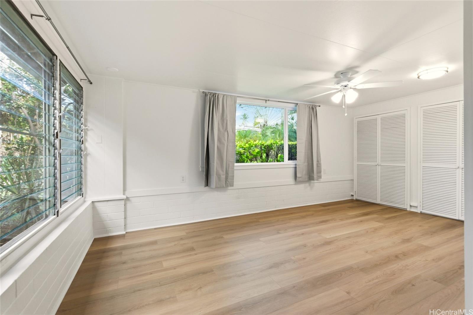 845 North Kalaheo Avenue Kailua, HI 96734 - Photo 7 of 18 a view of an empty room with a window and wooden floor