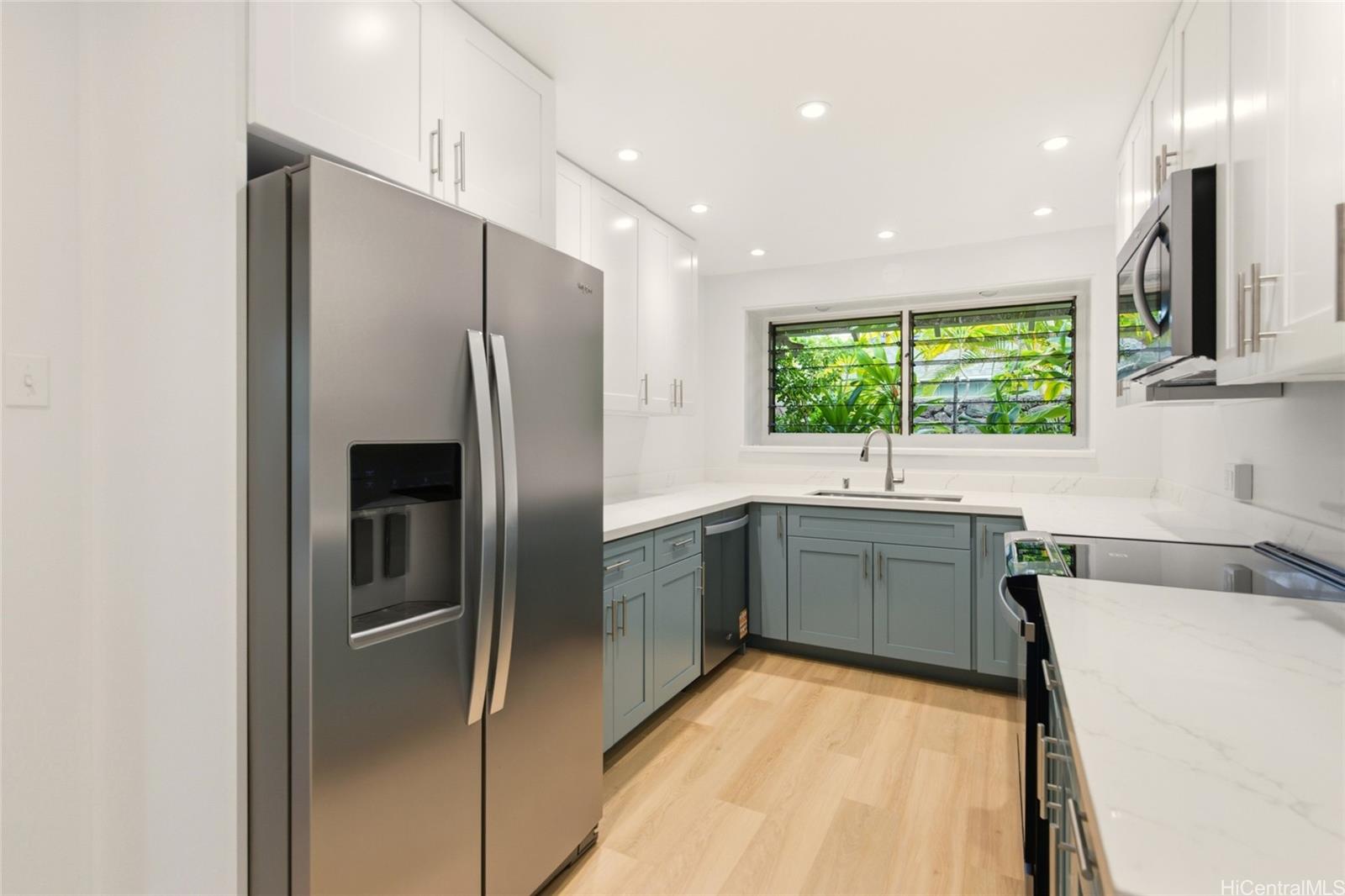 845 North Kalaheo Avenue Kailua, HI 96734 - Photo 8 of 18 a large kitchen with stainless steel appliances a sink stove and refrigerator