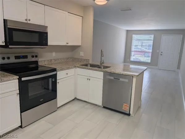a kitchen with a stove and a microwave