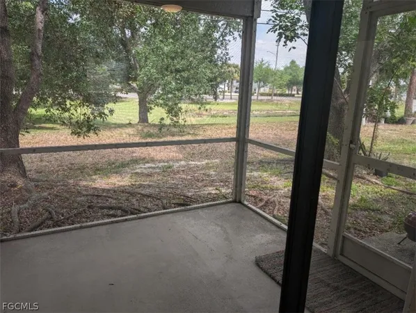 a view of a room with yard from balcony