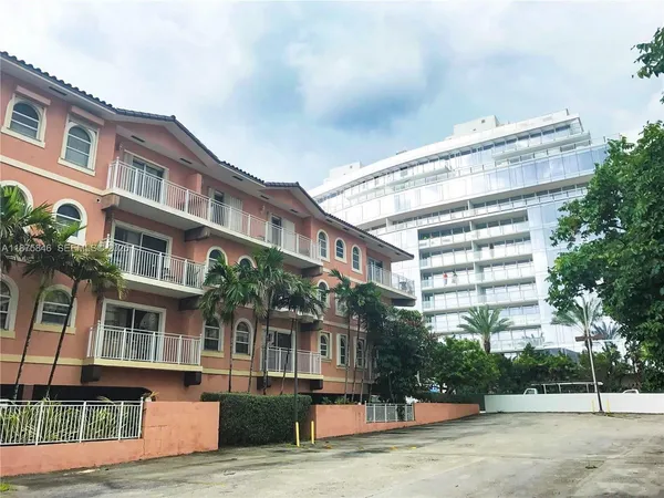 a view of building with outdoor space and seating area