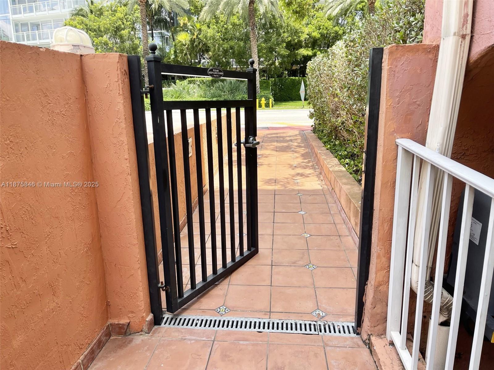 9008 Collins Avenue, Unit 402 Surfside, FL 33154 - Photo 37 of 49 a view of a balcony with wooden floor