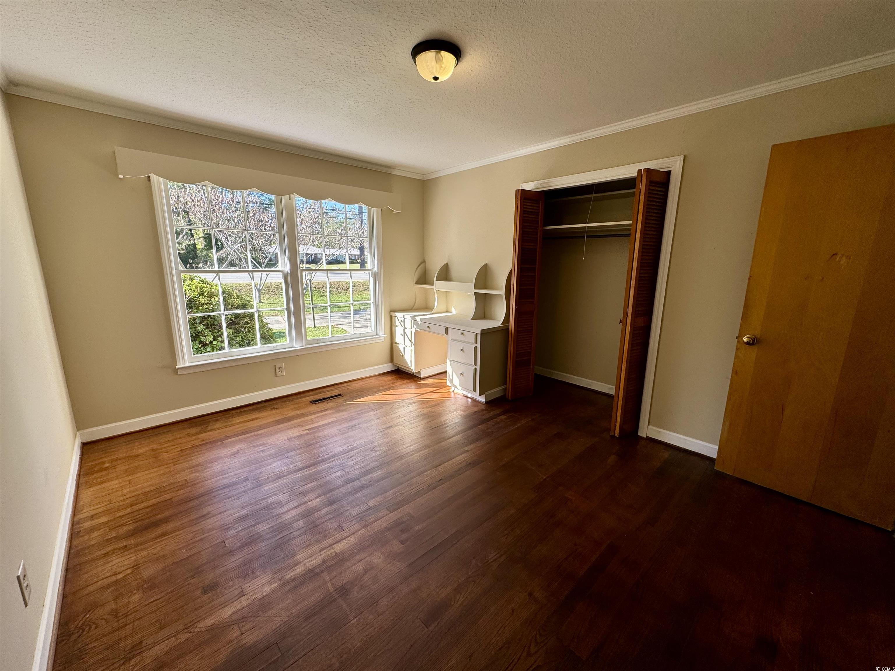 409 North Main Street Hemingway, SC 29554 - Photo 16 of 27 Unfurnished bedroom featuring a textured ceiling,