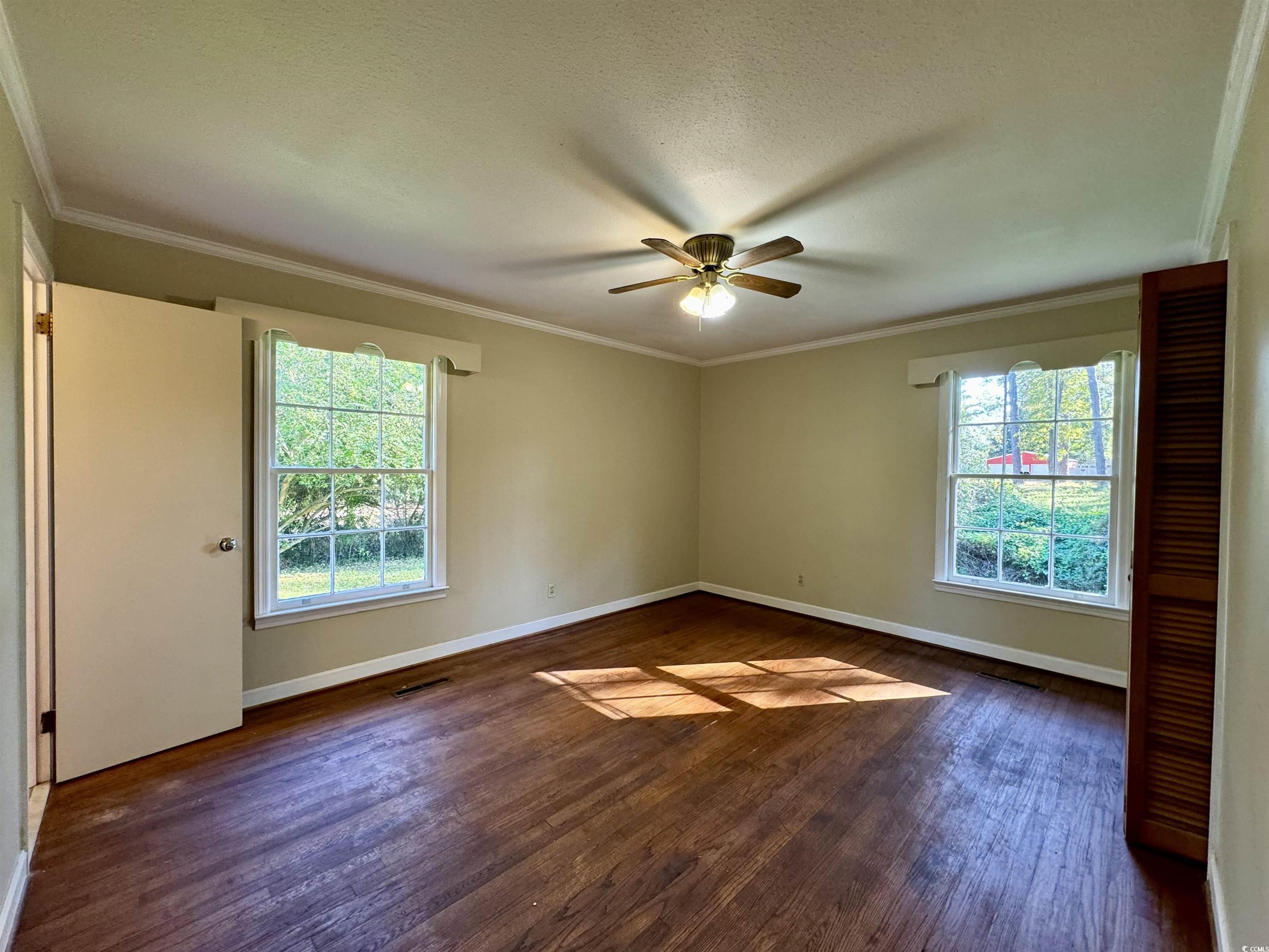 409 North Main Street Hemingway, SC 29554 - Photo 17 of 27 Empty room featuring a textured ceiling, dark hard