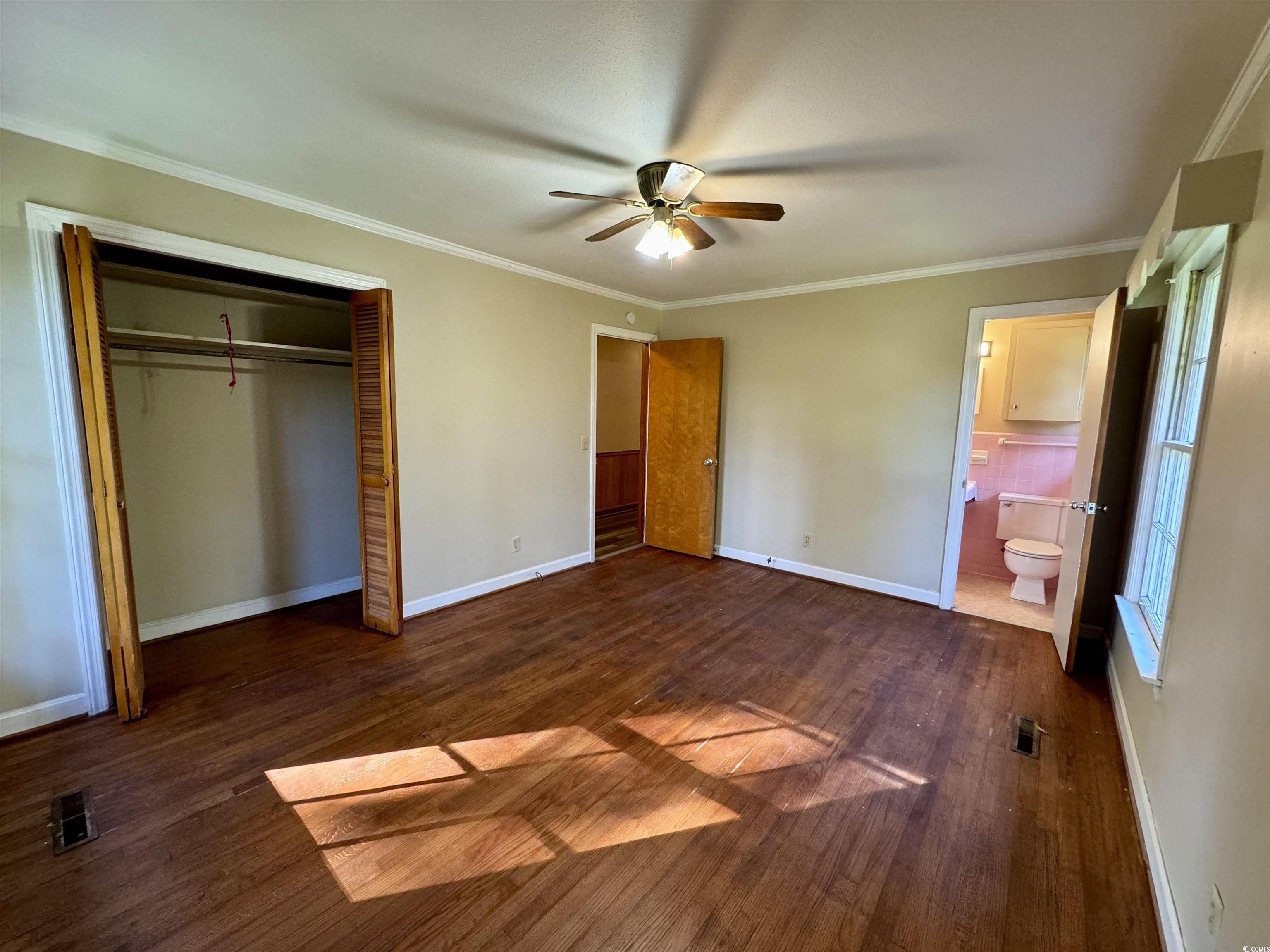 409 North Main Street Hemingway, SC 29554 - Photo 18 of 27 Unfurnished bedroom featuring ensuite bath, orname