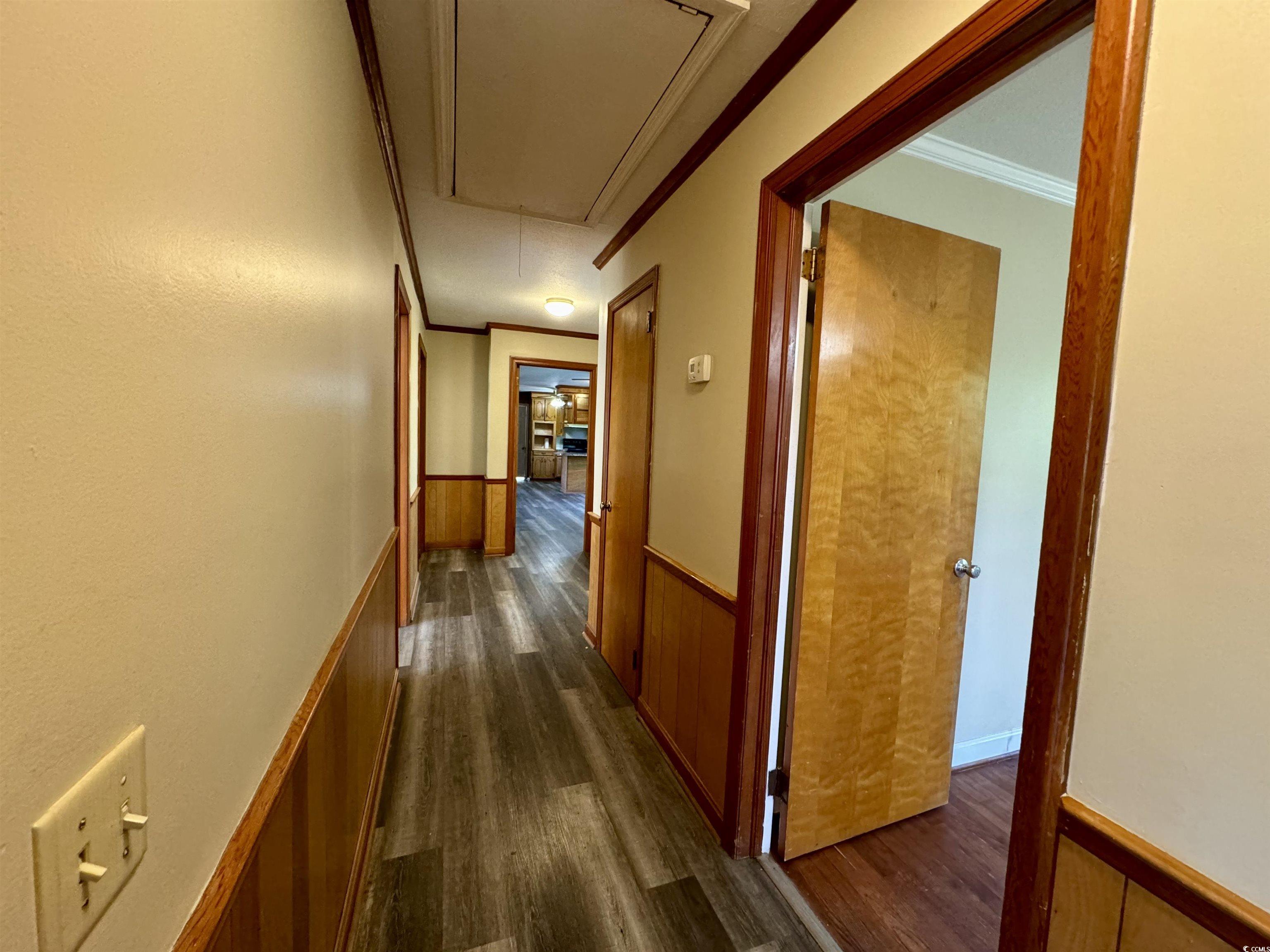 409 North Main Street Hemingway, SC 29554 - Photo 20 of 27 Corridor featuring dark hardwood / wood-style floo
