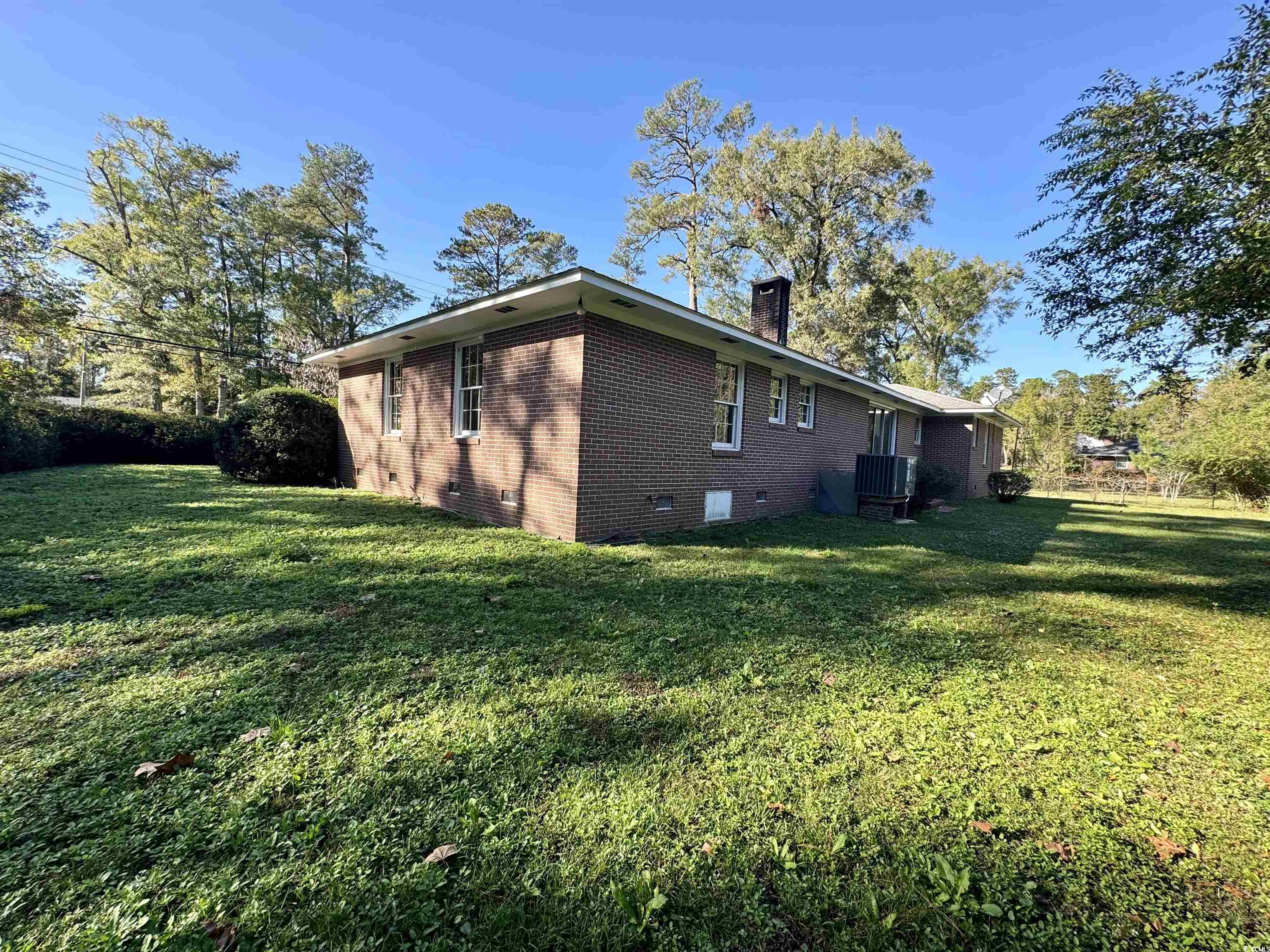 409 North Main Street Hemingway, SC 29554 - Photo 26 of 27 View of property exterior with a lawn