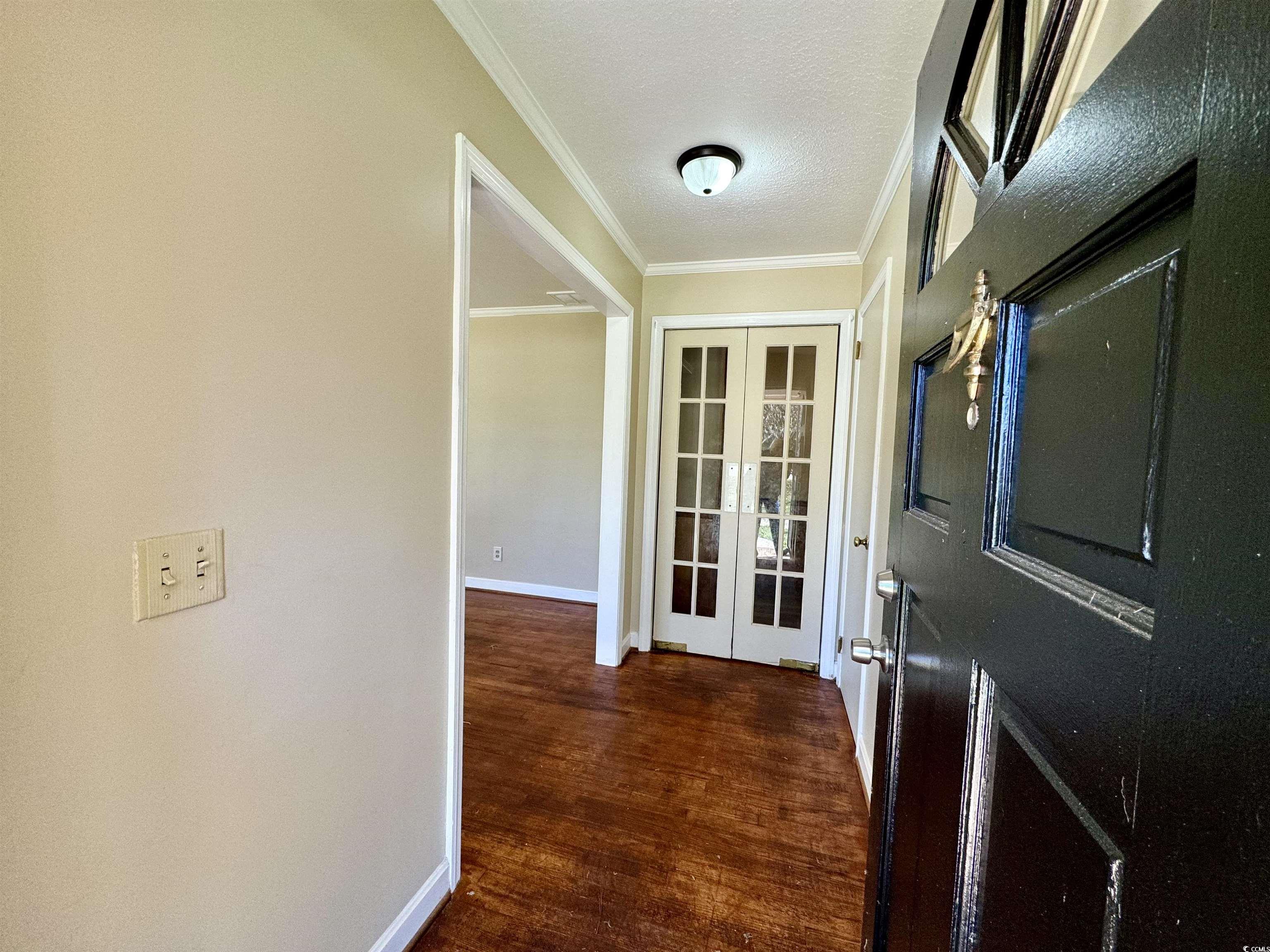409 North Main Street Hemingway, SC 29554 - Photo 4 of 27 Doorway to outside featuring a textured ceiling, o