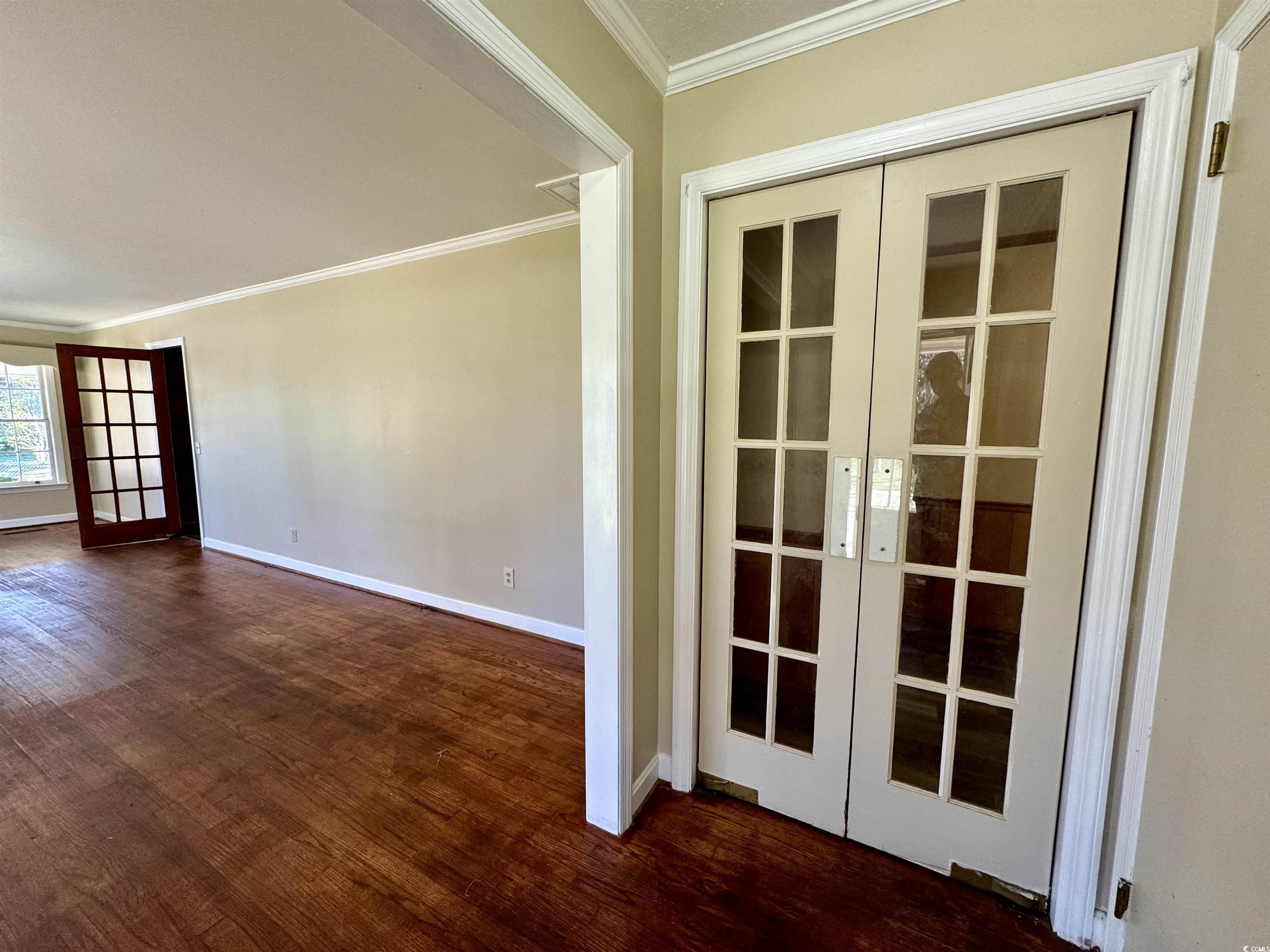 409 North Main Street Hemingway, SC 29554 - Photo 5 of 27 Empty room featuring dark wood-type flooring, fren
