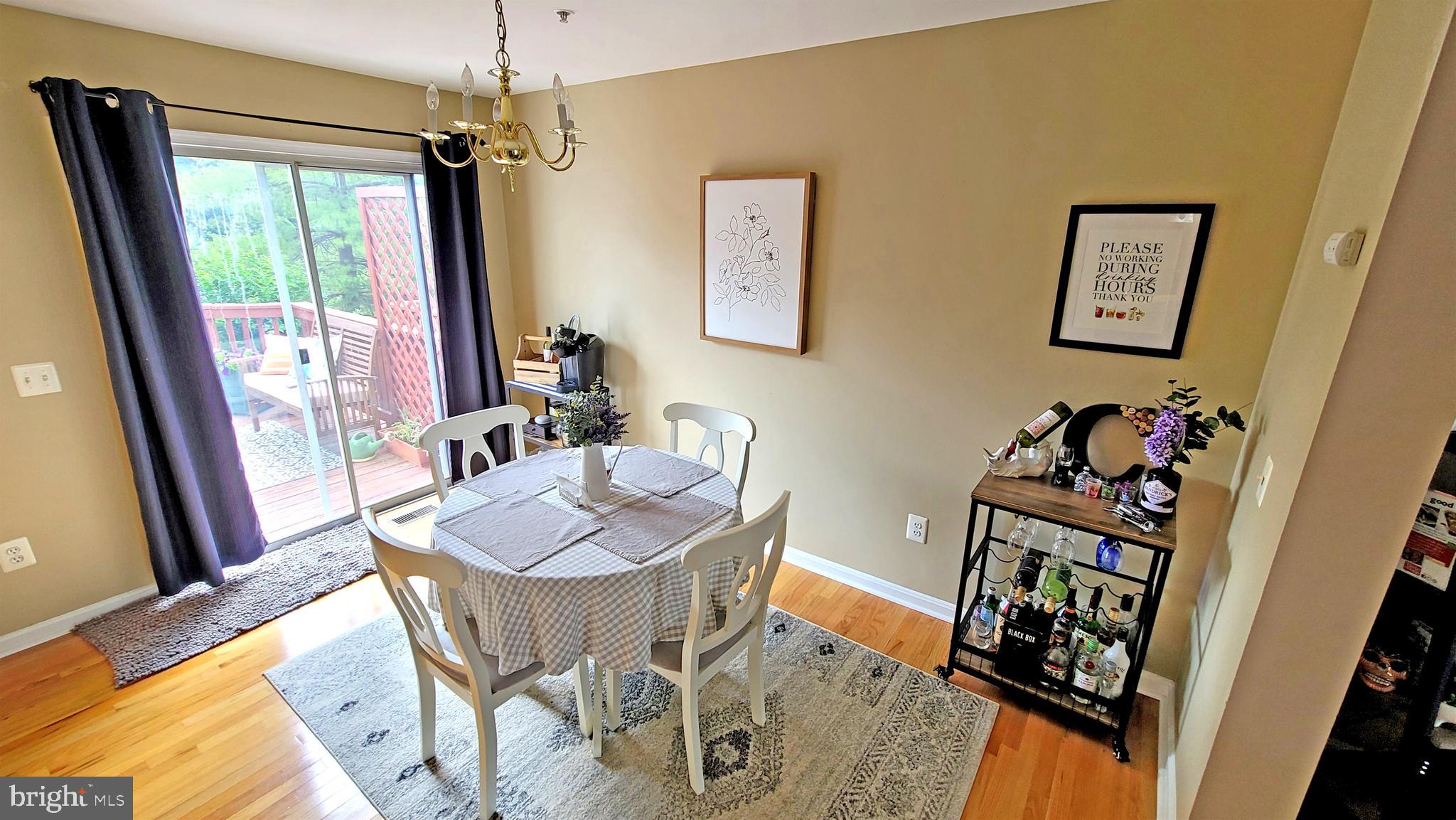 732 Howards Loop Annapolis, MD 21401 - Photo 3 of 26 Dining area off kitchen with sliders to deck