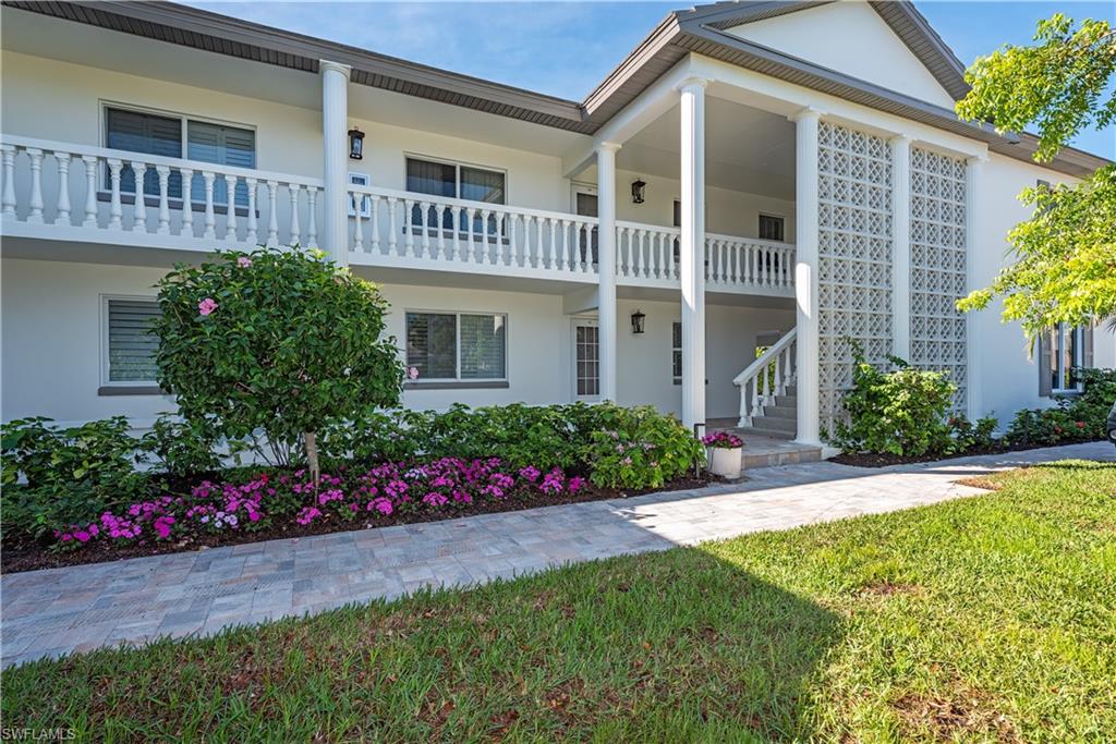4155 Crayton Road, Unit 109 Naples, FL 34103 - Photo 12 of 21 View of front of house featuring a front yard