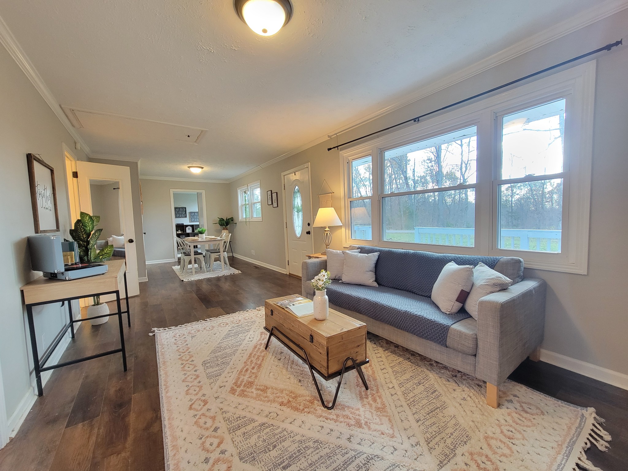 185 B Y Brown Road Charlotte, TN 37036 - Photo 13 of 52 a living room with furniture wooden floor and a large window