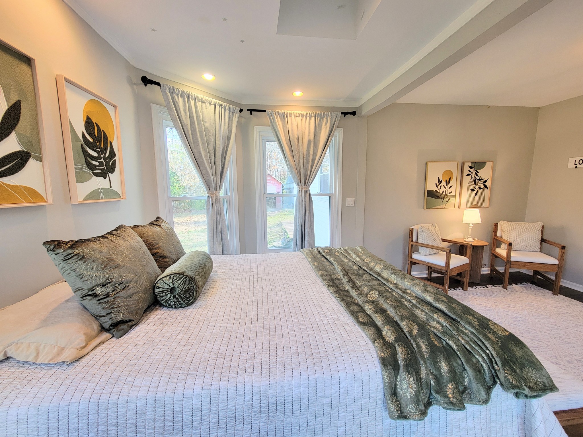 185 B Y Brown Road Charlotte, TN 37036 - Photo 22 of 52 a large bedroom with a bed and wooden floor
