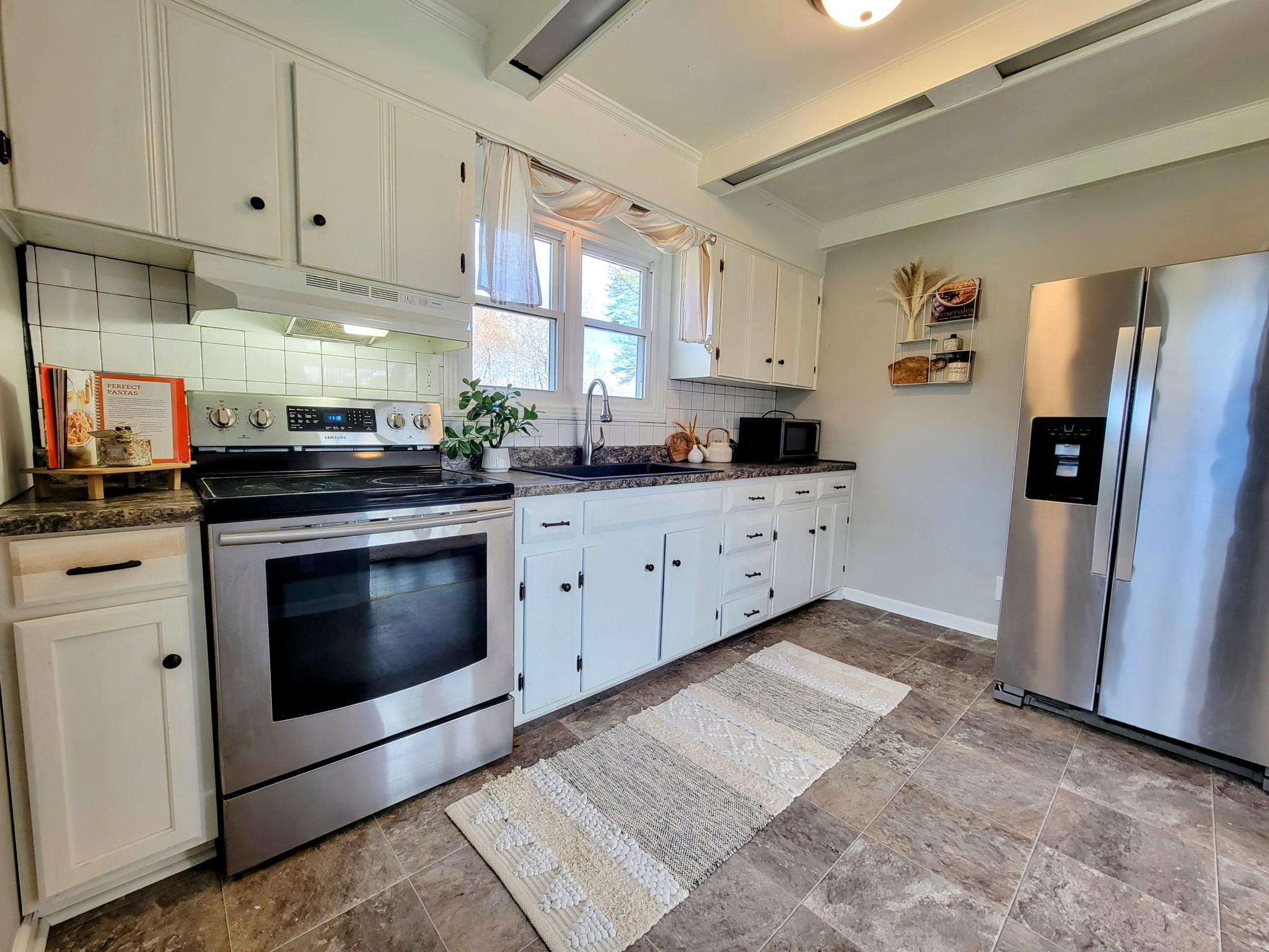 185 B Y Brown Road Charlotte, TN 37036 - Photo 26 of 52 a kitchen with stainless steel appliances granite countertop a stove a sink and a refrigerator