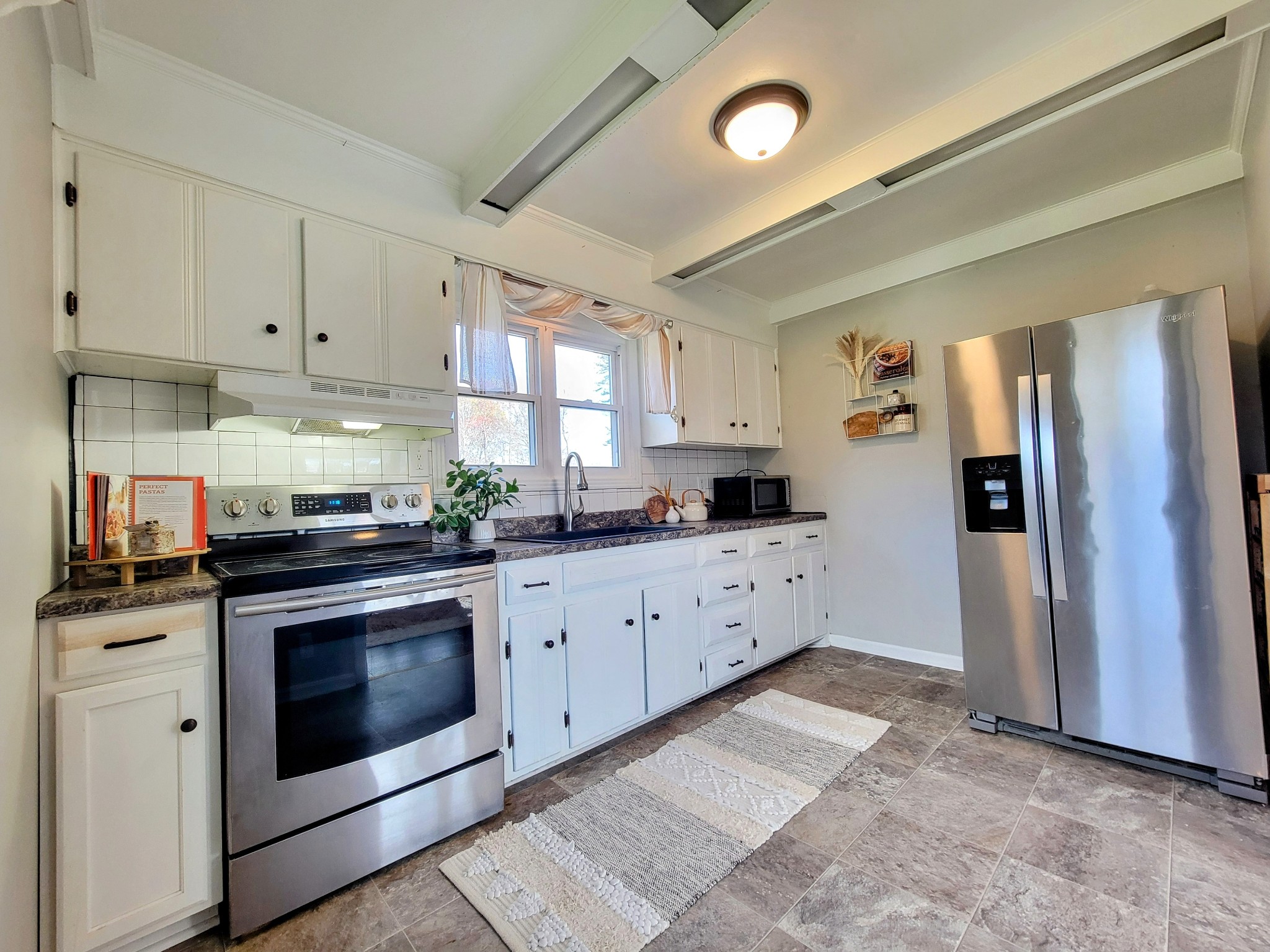 185 B Y Brown Road Charlotte, TN 37036 - Photo 27 of 52 a kitchen with granite countertop a refrigerator stove and sink