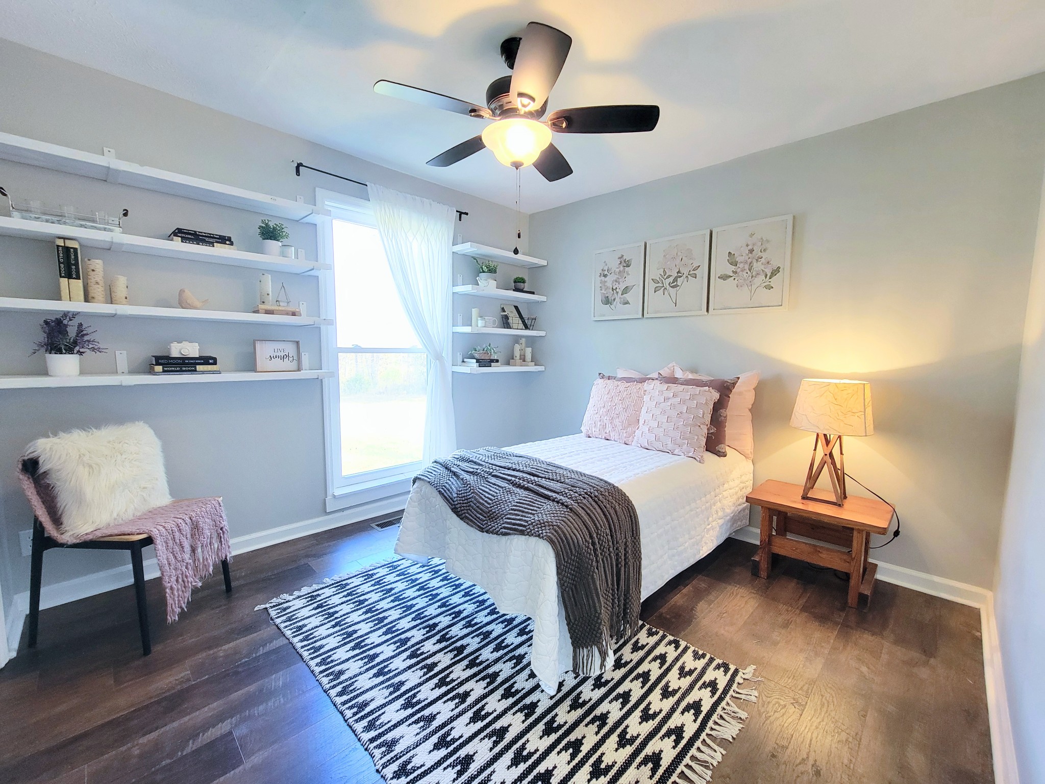 185 B Y Brown Road Charlotte, TN 37036 - Photo 36 of 52 a bedroom with a bed and a chandelier