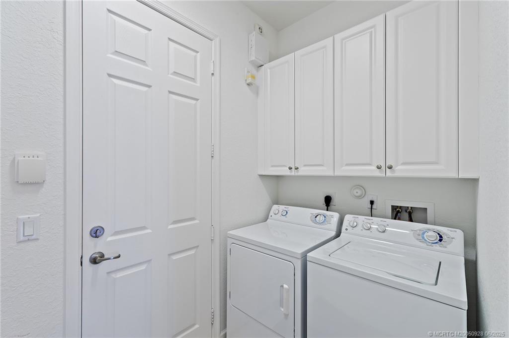 170 Southwest Walking Path Stuart, FL 34997 - Photo 8 of 18 a view of storage and utility room with washer and dryer