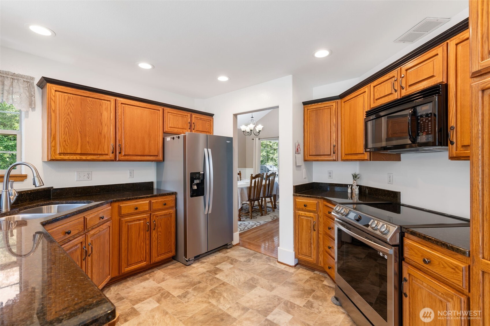 308 Brockway Road Chehalis, WA 98532 - Photo 13 of 40 a kitchen with stainless steel appliances granite countertop a refrigerator a stove top oven a sink and dishwasher