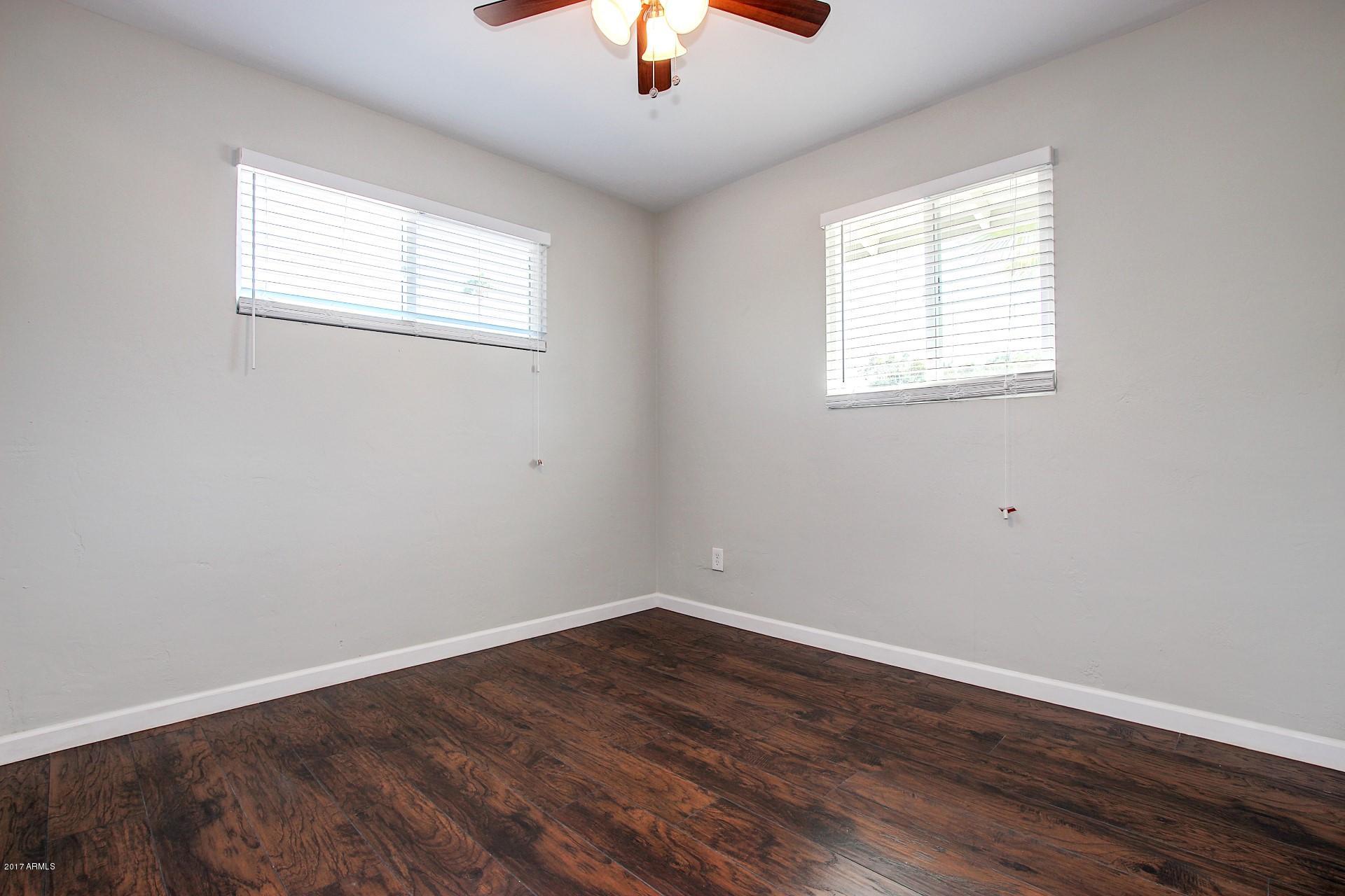 4844 East Coronado Road Phoenix, AZ 85008 - Photo 13 of 26 an empty room with a window