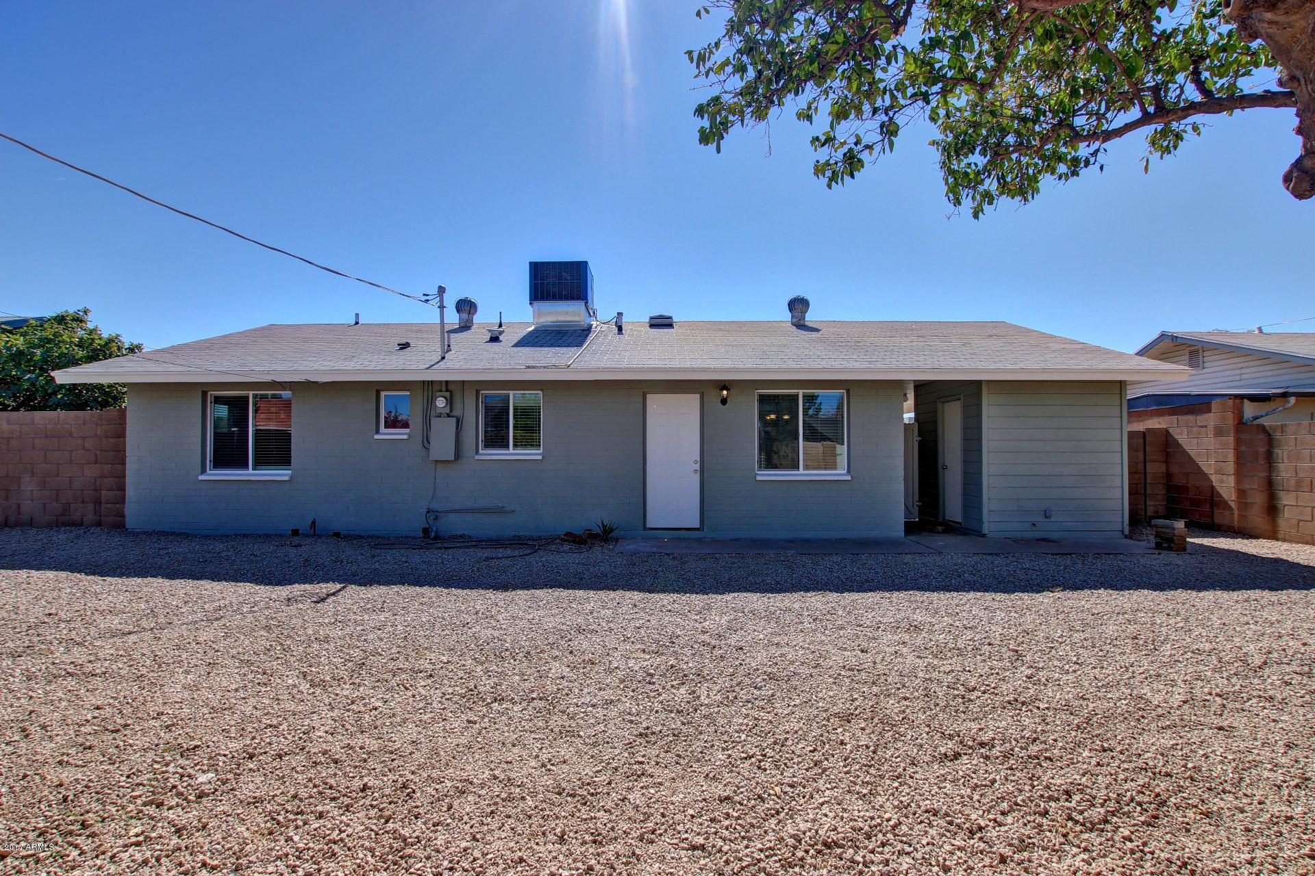 4844 East Coronado Road Phoenix, AZ 85008 - Photo 23 of 26 a front view of a house with garden