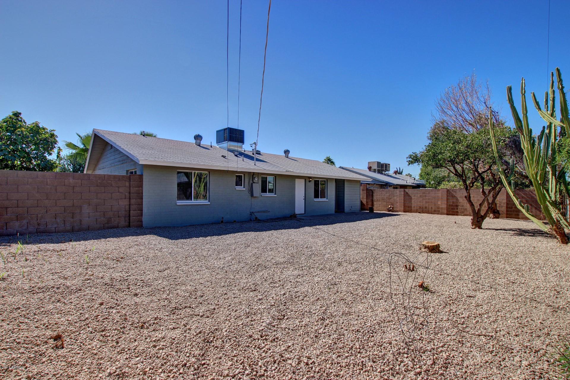 4844 East Coronado Road Phoenix, AZ 85008 - Photo 24 of 26 a front view of a house with a yard