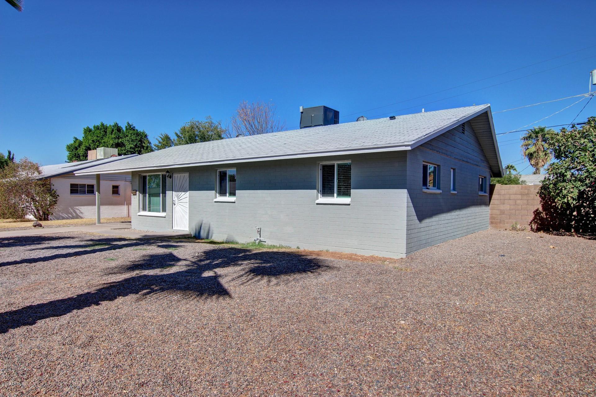 4844 East Coronado Road Phoenix, AZ 85008 - Photo 3 of 26 a front view of a house with garden