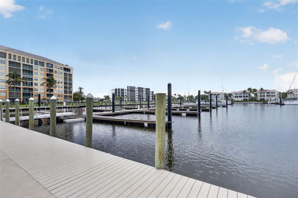 2060 Matecumbe Key Road, Unit 2506 Punta Gorda, FL 33955 - Photo 27 of 38 a view of a lake with boats and trees in the background