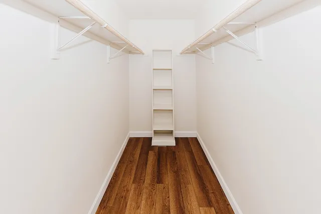 a bathroom with a granite countertop shower mirror and a sink