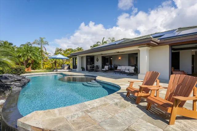 a view of a house with swimming pool and porch
