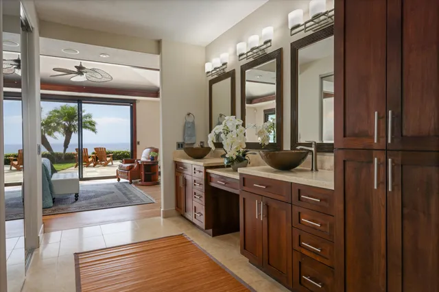 a spacious bathroom with a double vanity sink and a mirror
