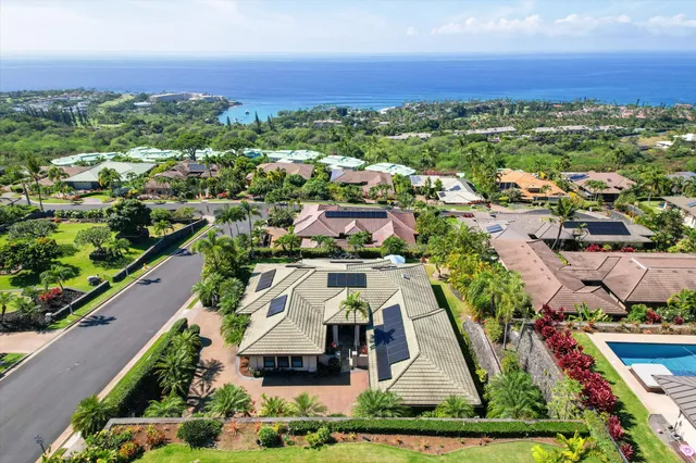 an aerial view of a house with a garden