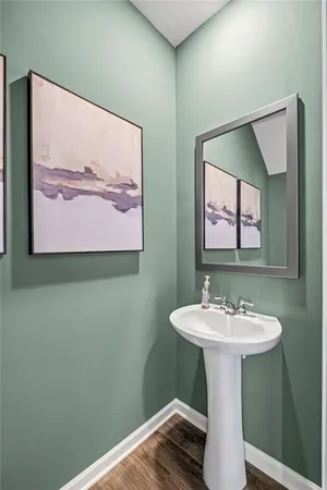 a bathroom with a sink mirror and vanity