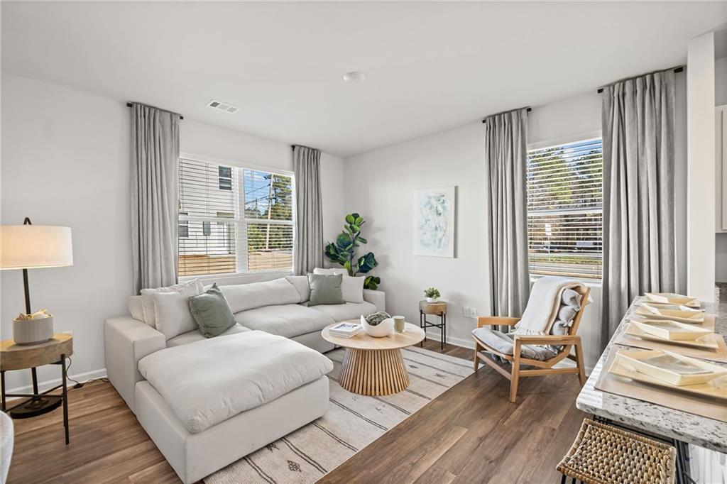 7 Silverbell Lane Northwest Rome, GA 30165 - Photo 8 of 24 a living room with furniture and a large window