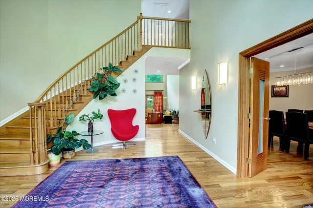 a view of an entryway door with a staircase